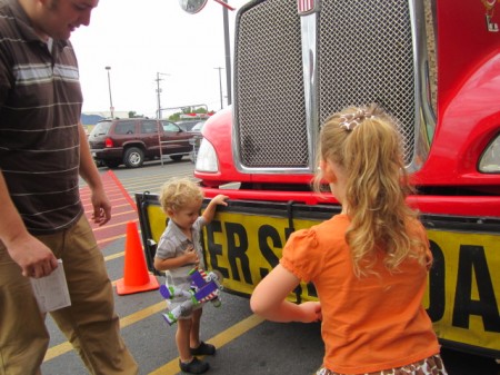 This little guy cared more about our big sign and whats under the truck more than anything else! I'm sensing a future mechanic ;)
