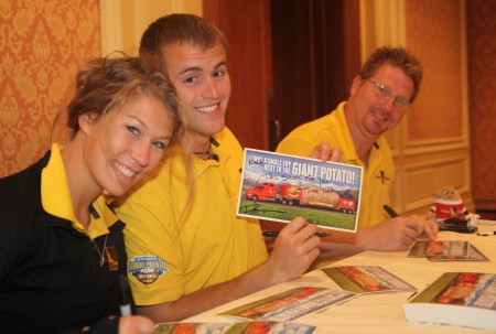 Tater Team signs postcards of the truck